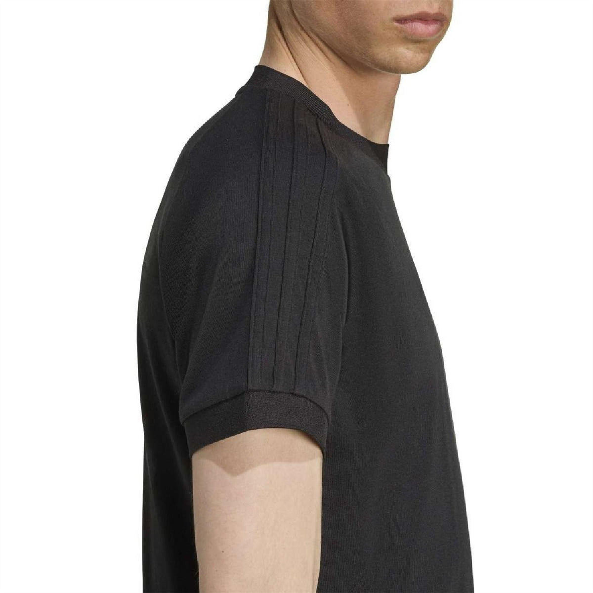 Black raglan T-shirt sleeve close-up showing seam and smooth fabric
