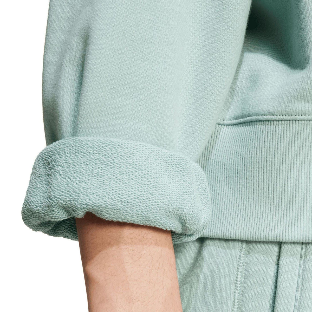 Mint green hoodie sleeve with ribbed cuff and hem with visible seam detail