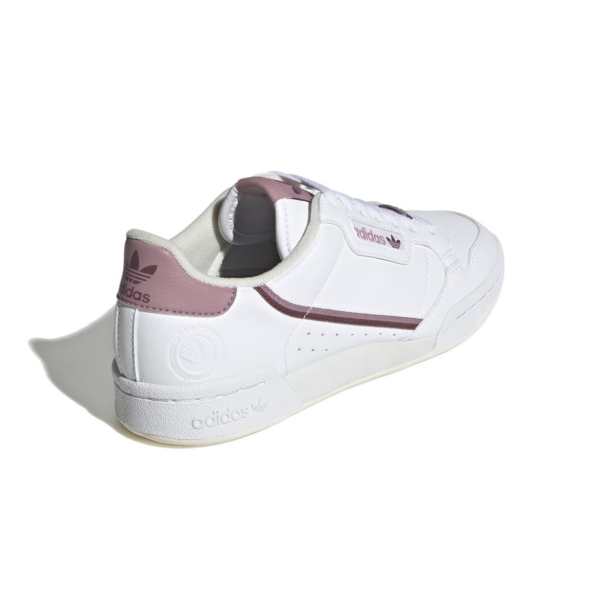 Women's white vegan trainers showing padded collar and mauve heel panel