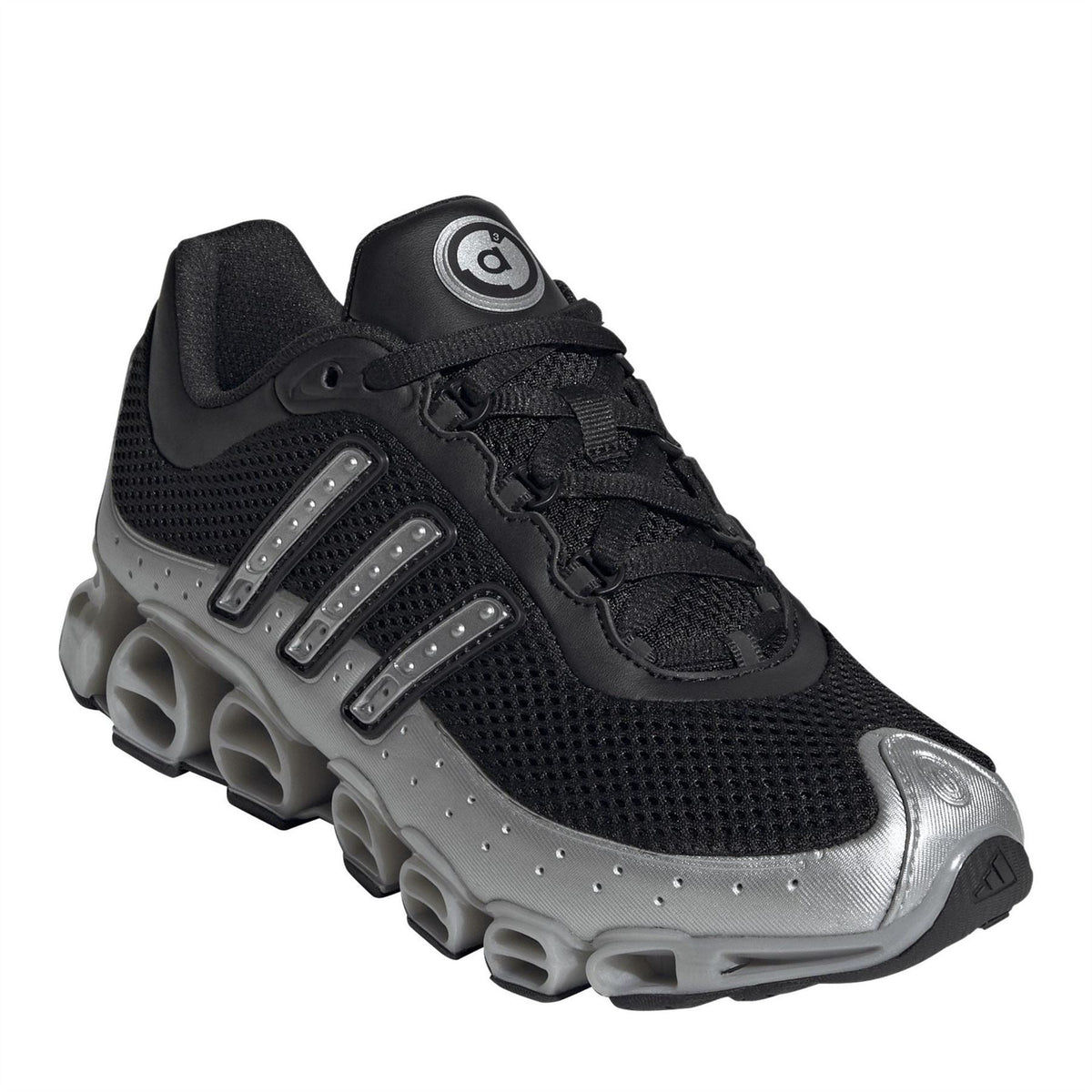 Black lace-up sneaker with silver side stripes, mesh upper, and cushioned chunky sole