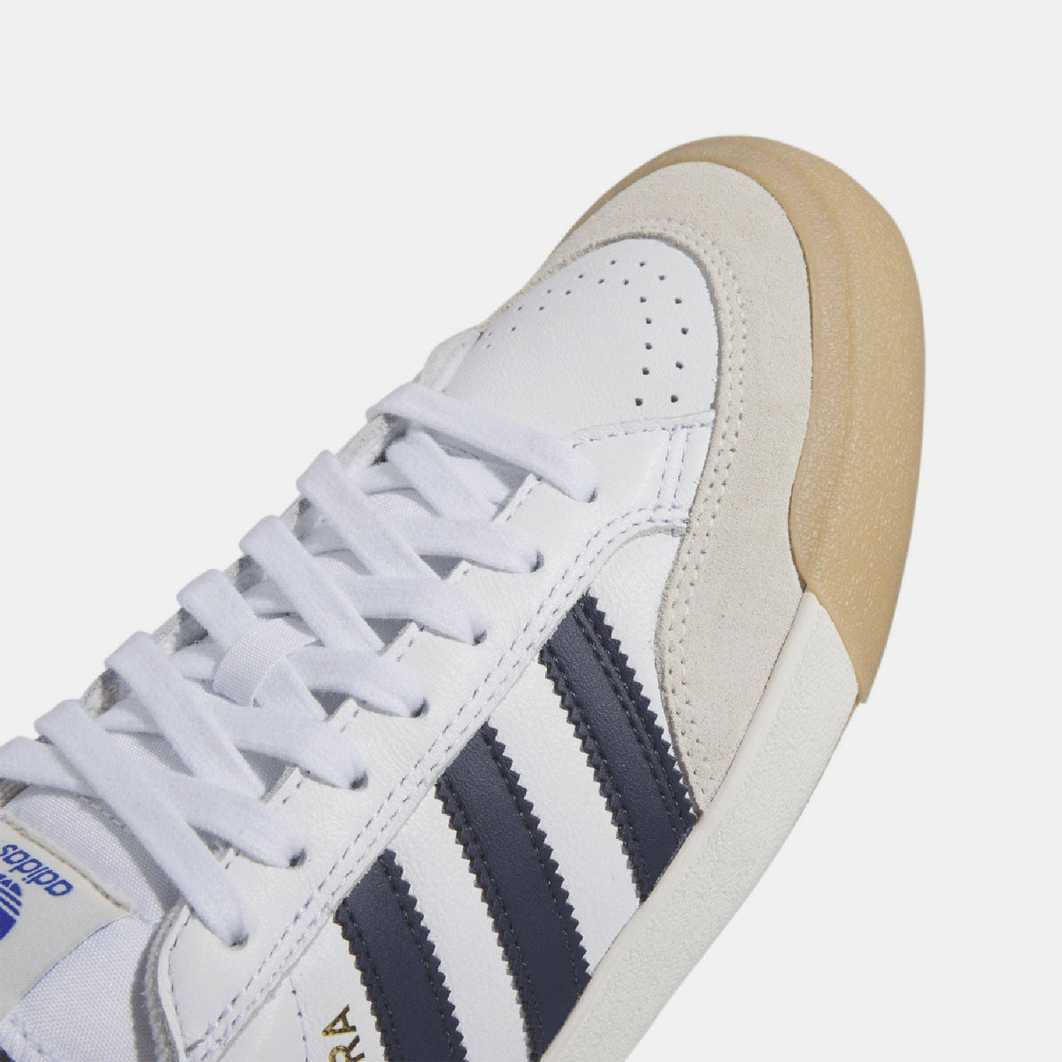 adidas Originals Nora trainers close-up of white leather upper and navy 3-stripe panel