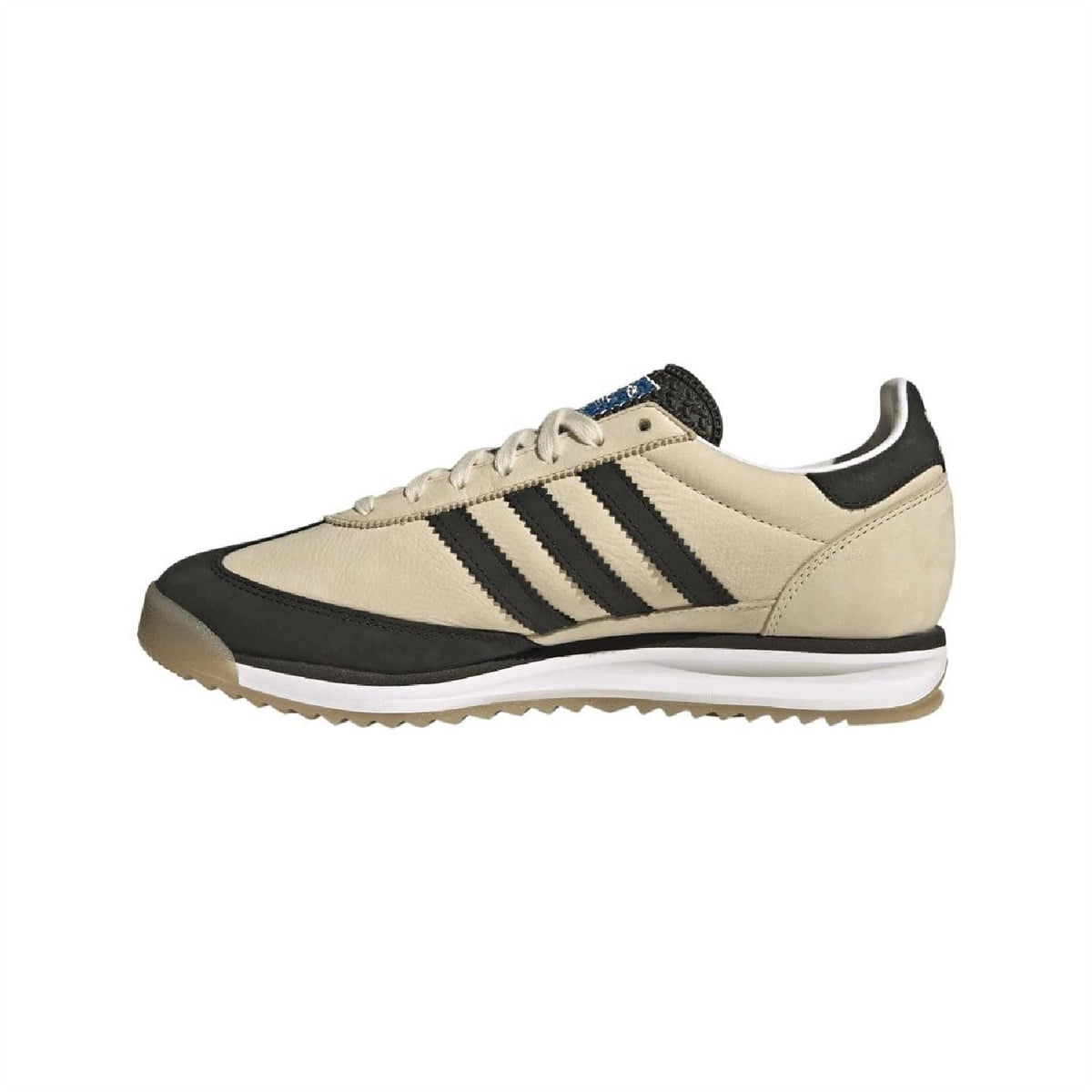 Beige and black adidas low-top sneaker with three-bar stripes and lace-up design