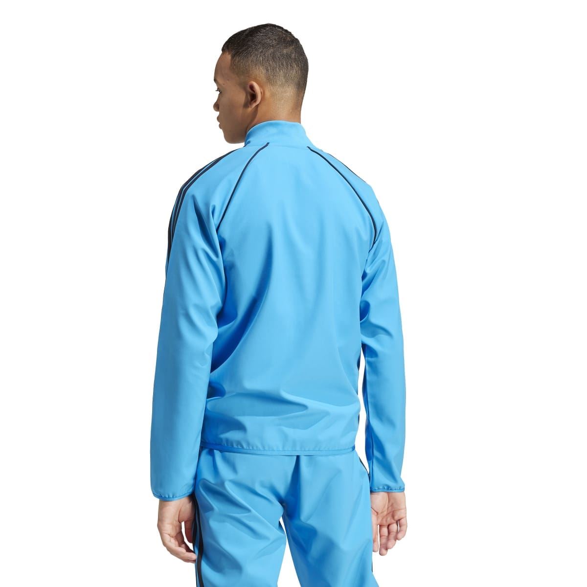 Blue adidas track jacket back view with high collar and full-zip front seams