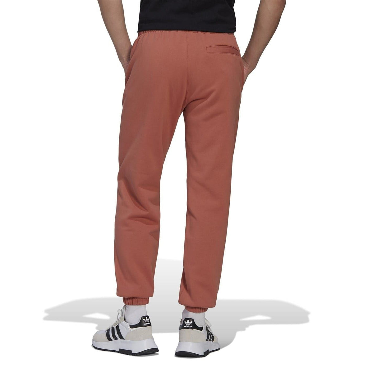 adidas Originals brown straight sweatpants, back view with stitched seams and rear pocket