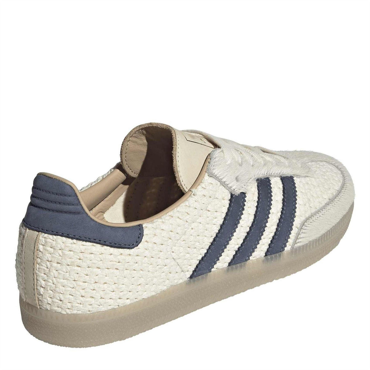 Cream woven lace-up sneakers with navy collar and cushioned interior lining