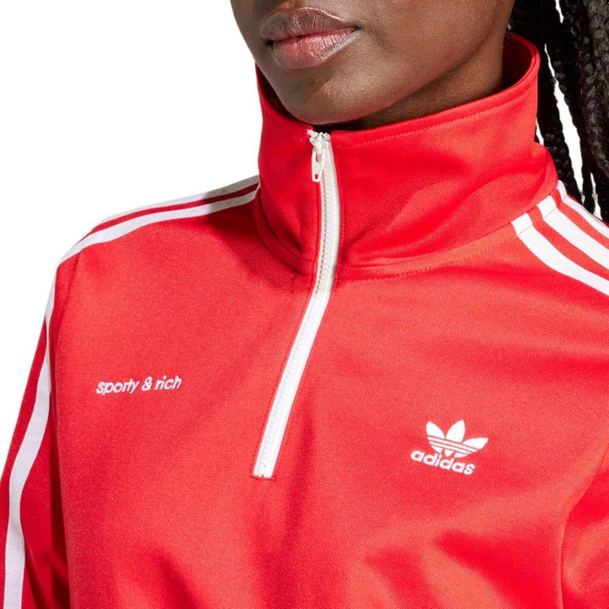 Red adidas track top close-up with high neck zip and adidas logo