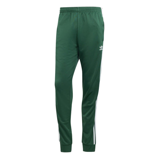 Green slim track pants with white side stripes, elastic waistband, tapered cuffs