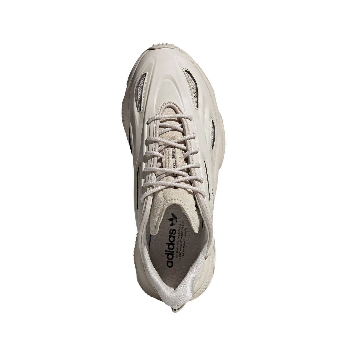 adidas Ozweego trainers heel view in light cream with lace-up top and cushioned collar