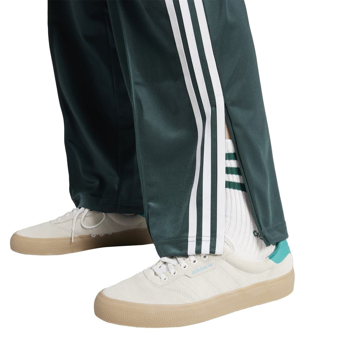 adidas Originals dark teal track pants with three white side stripes and ankle cuff