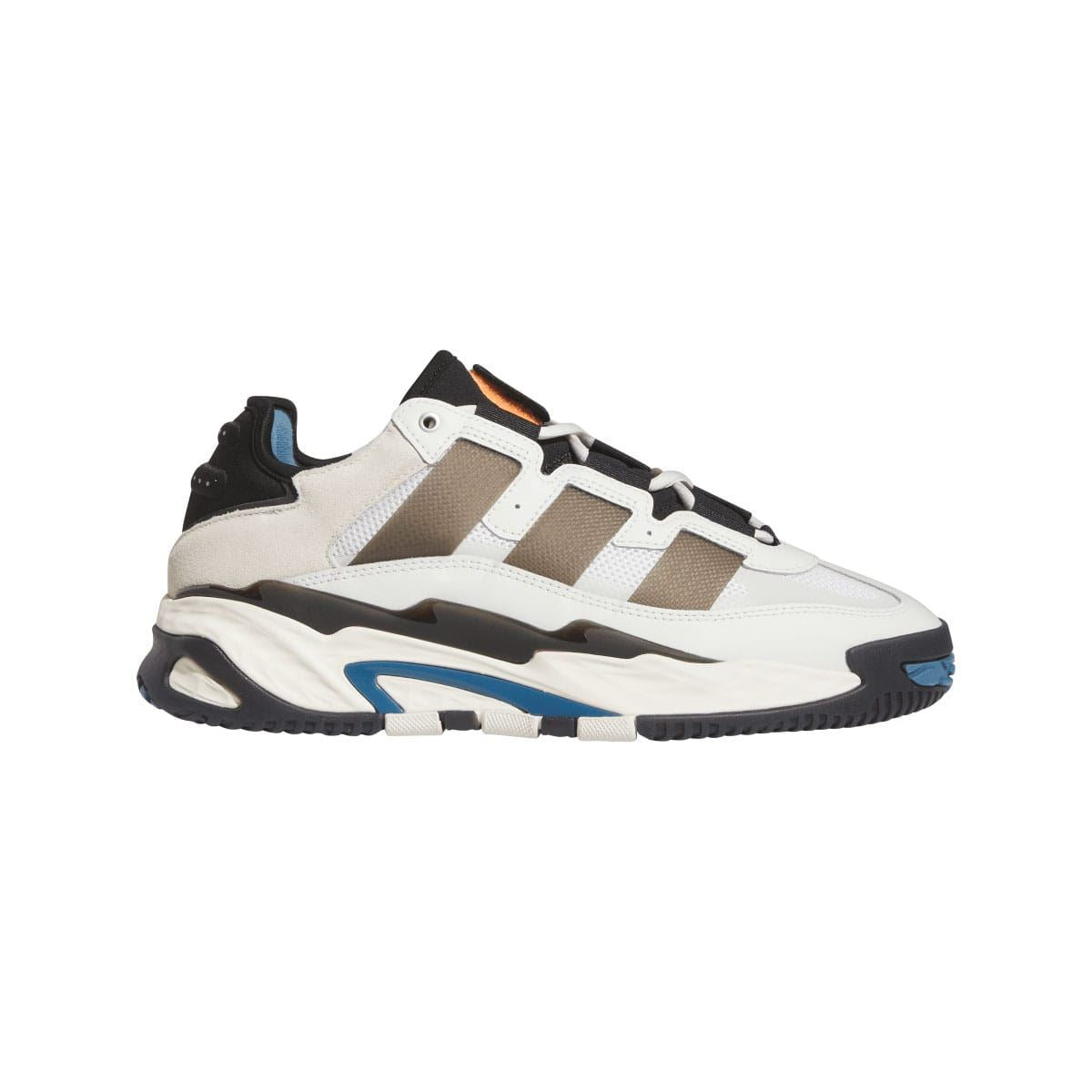 Niteball low-top sneakers in white with black suede panels and blue accents