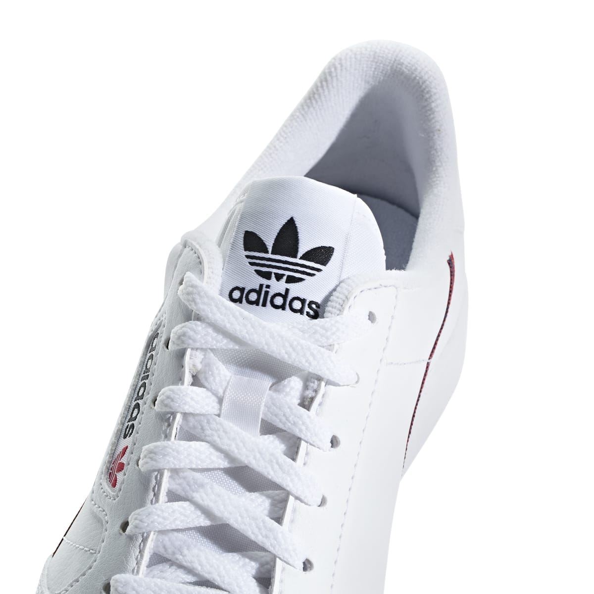 White Adidas Continental 80 junior sneaker with lace-up, trefoil logo and tongue label.