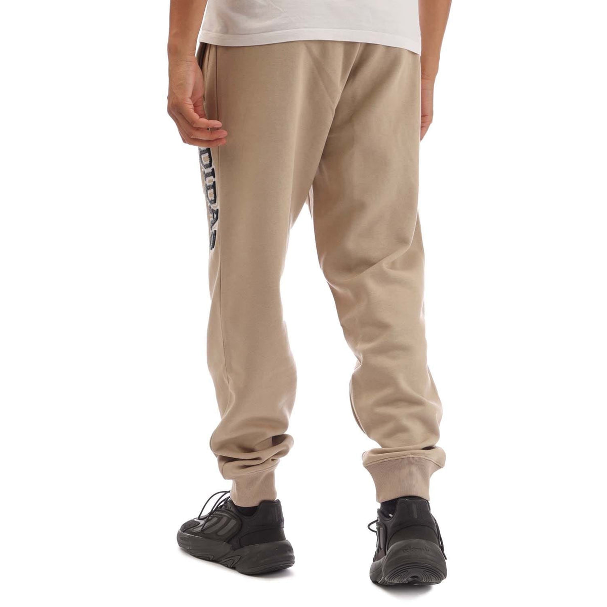 Khaki adidas joggers with relaxed fit, cuffed hems, side logo detail