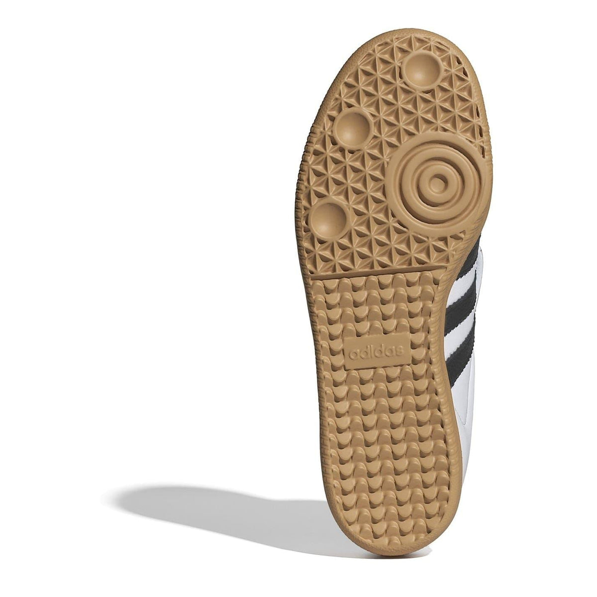 Sandal sole view of lace-up sneakers with textured gum rubber tread and Adidas branding.