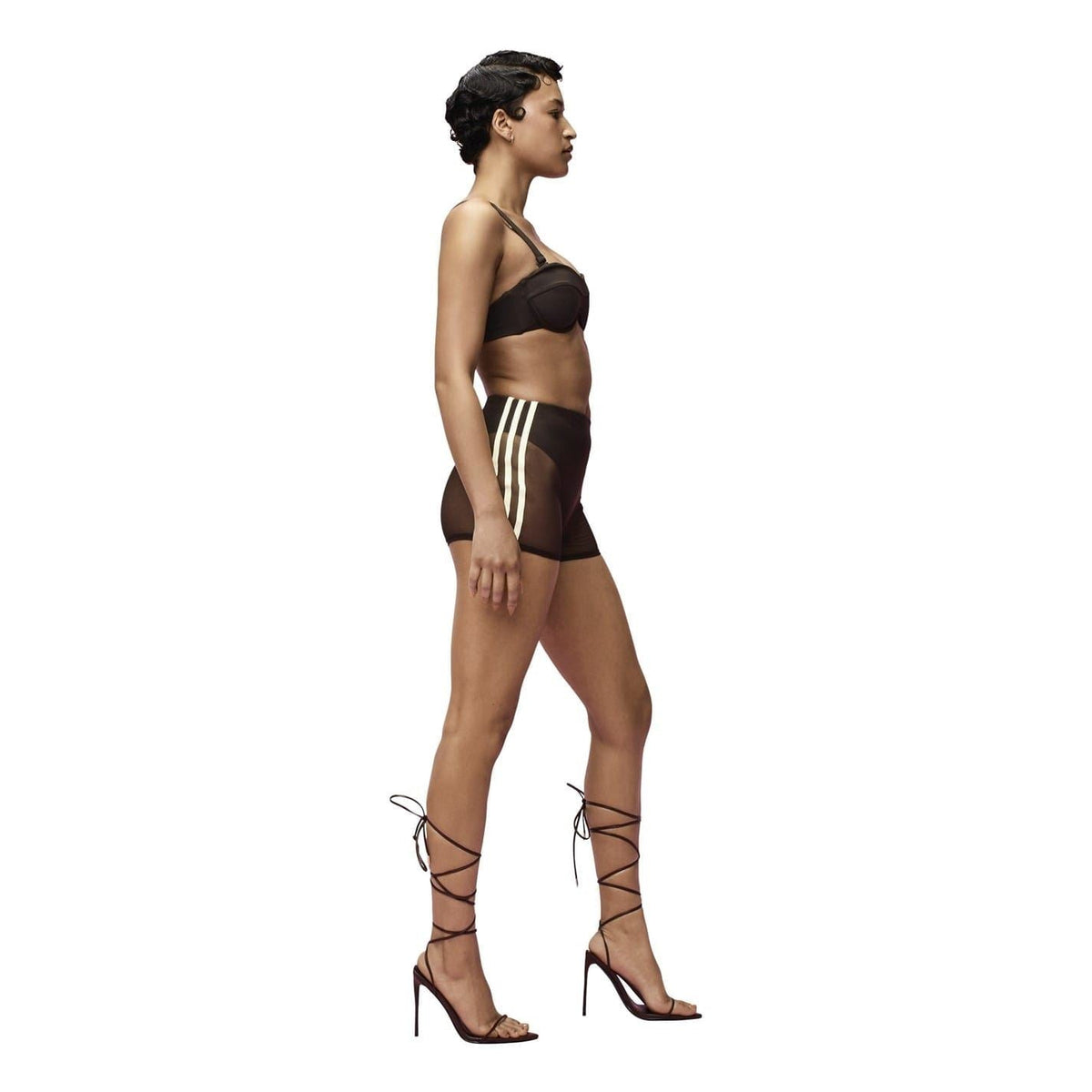 Brown mesh swim shorts on model, side view with contrast side stripe