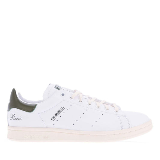 White high-top leather sneaker with green heel tab, lace-up front, and beige gum sole.