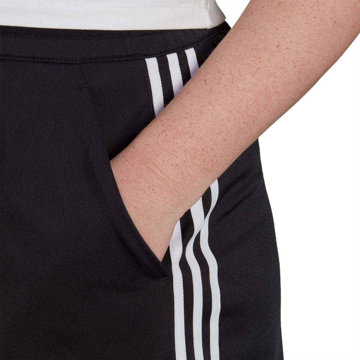 Black skirt with soft waistband and white triple stripe detailing on side panel