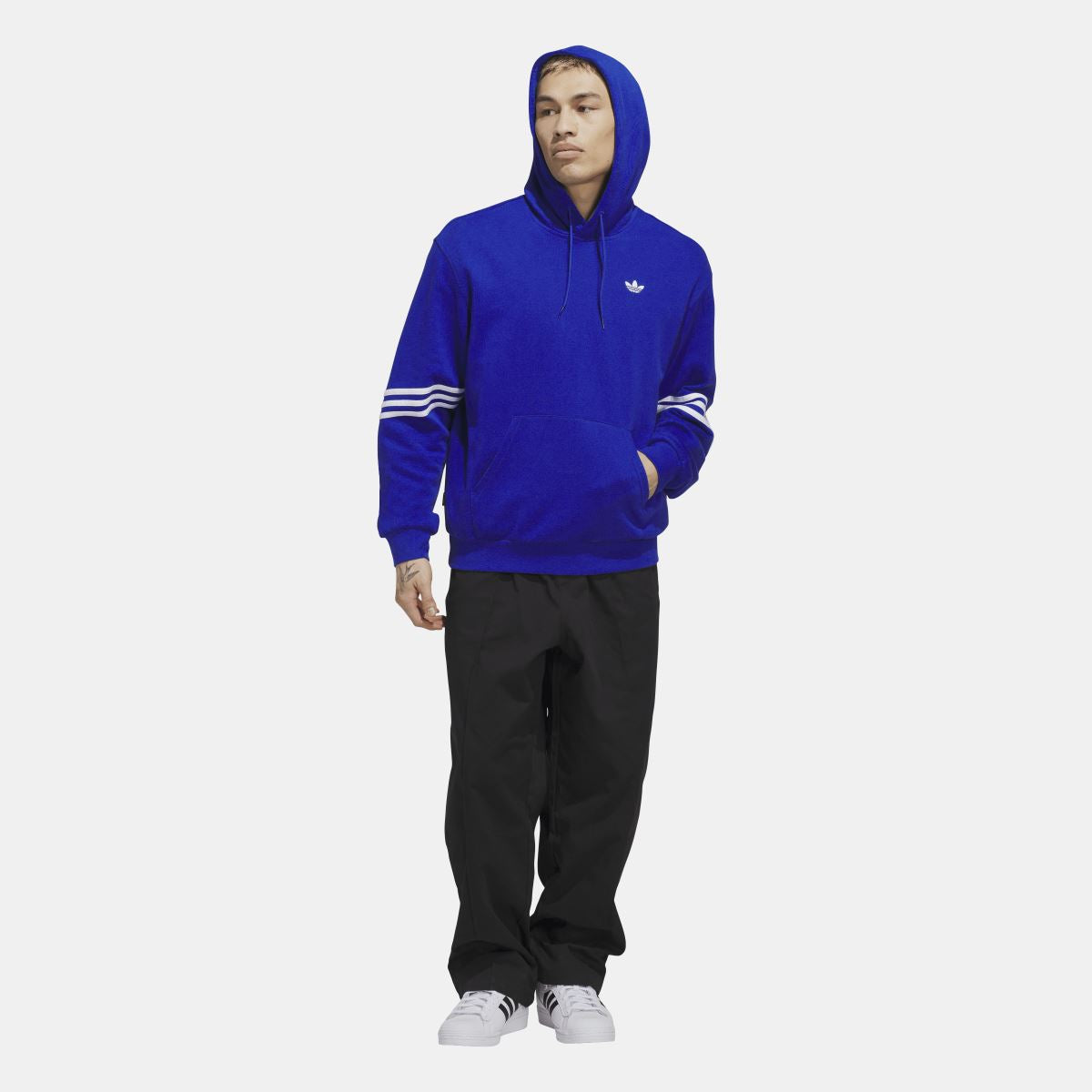 Blue adidas trefoil hoodie with drawstring hood, front pocket, and white striped sleeves.