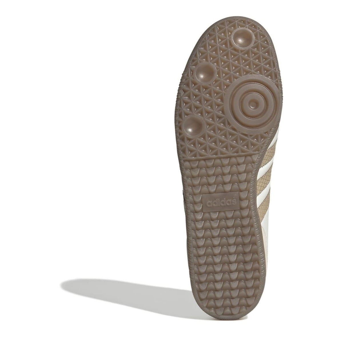 Gum rubber outsole for white and beige low-top sneakers with tread pattern and heel branding