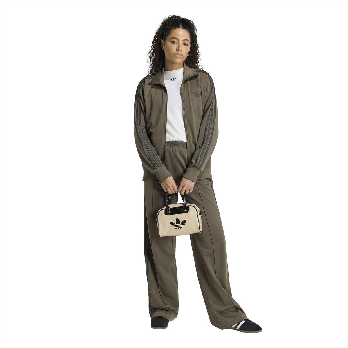 Olive green womens jogger pants with side stripe detail and relaxed fit