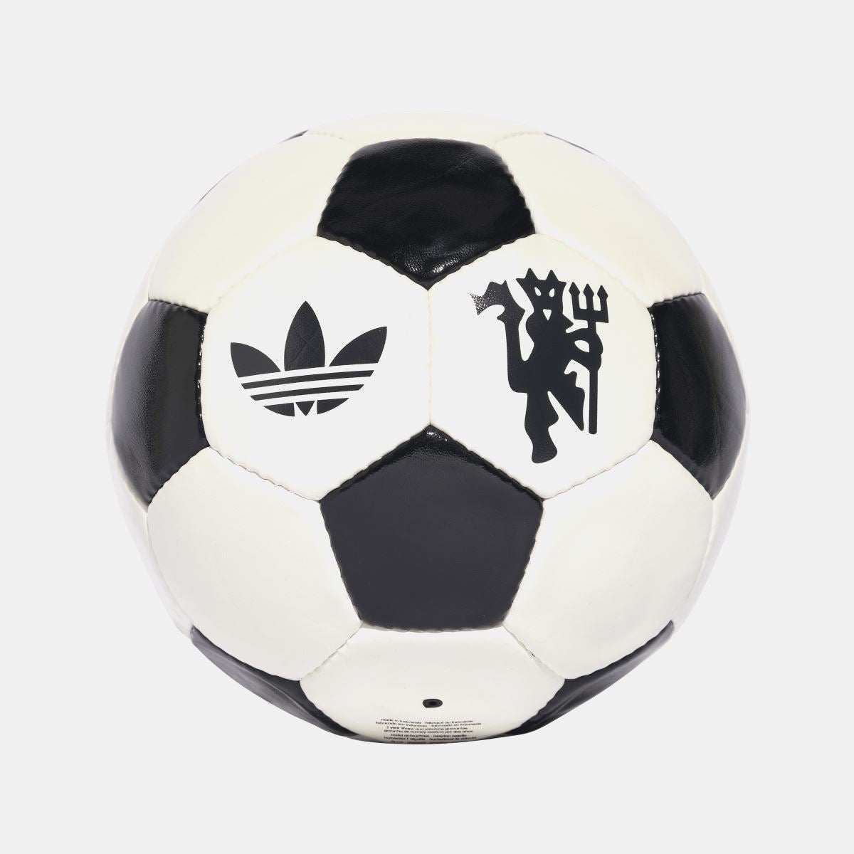 Off-white and black soccer ball with adidas trefoil and club crest