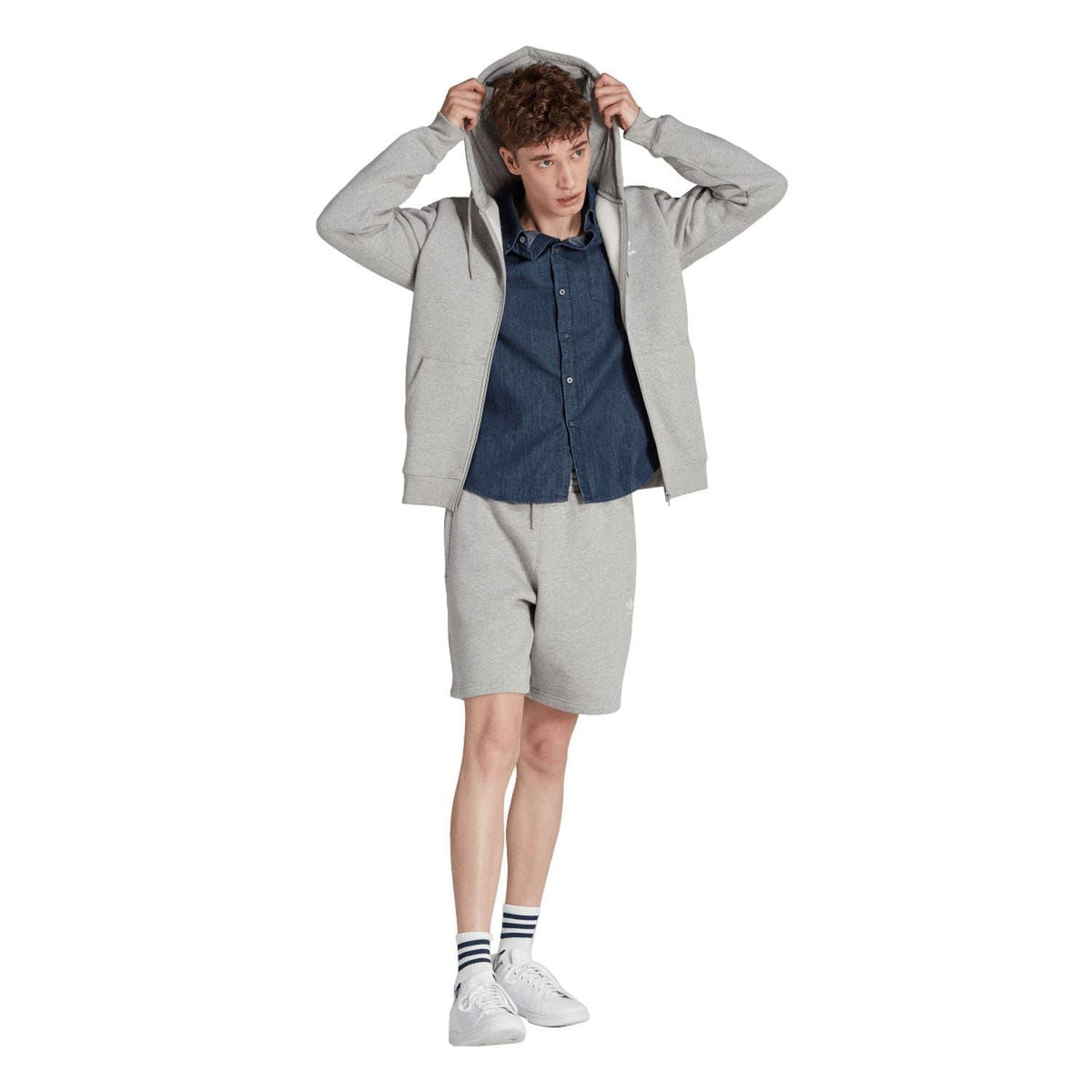 Grey full-zip hoodie worn with matching shorts; hood, drawstrings, and zip front.