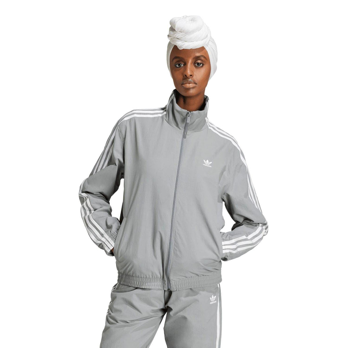 adidas Originals grey woven track jacket with full zip and three-stripe sleeves