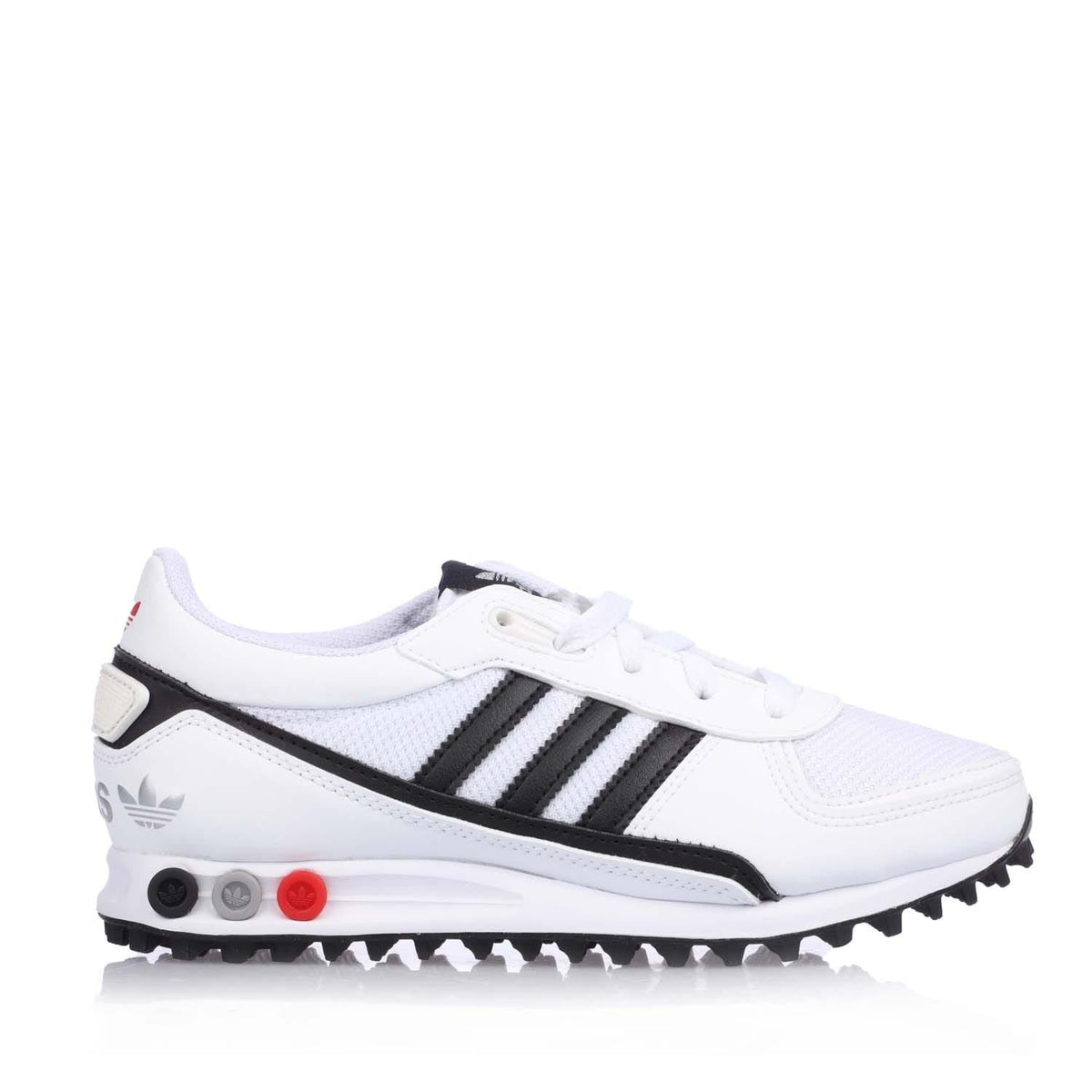 White junior Adidas LA Trainer II sneakers with black stripes and red accent sole.