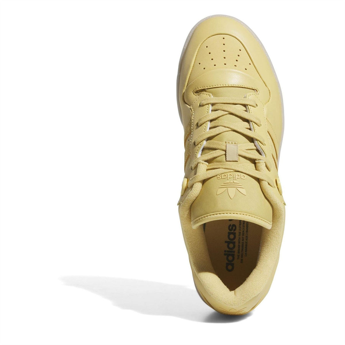 adidas Rivalry low-top flatform sneaker, yellow upper with lace-up and adidas label