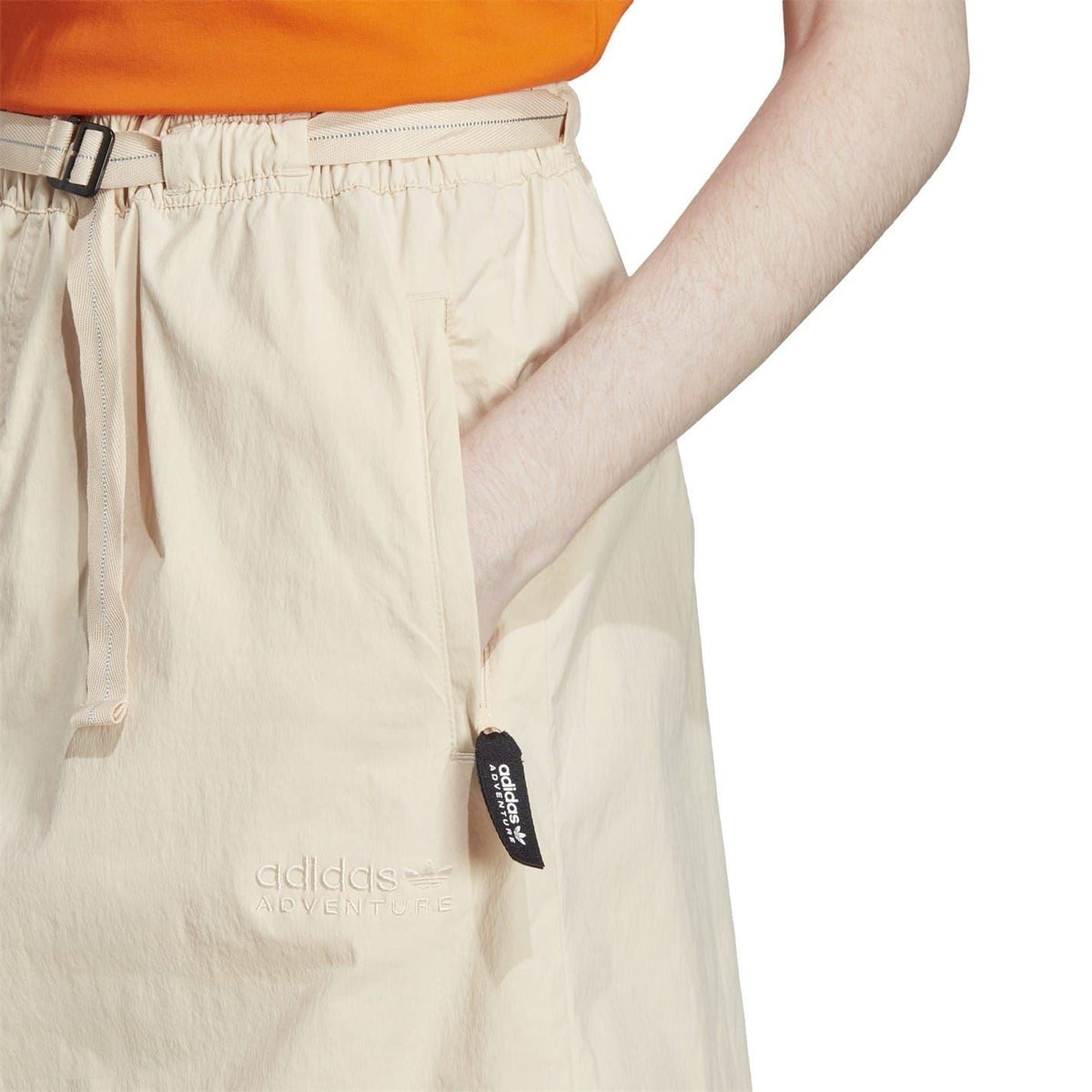 Light beige adidas Originals shorts with drawstring waist and logo patch