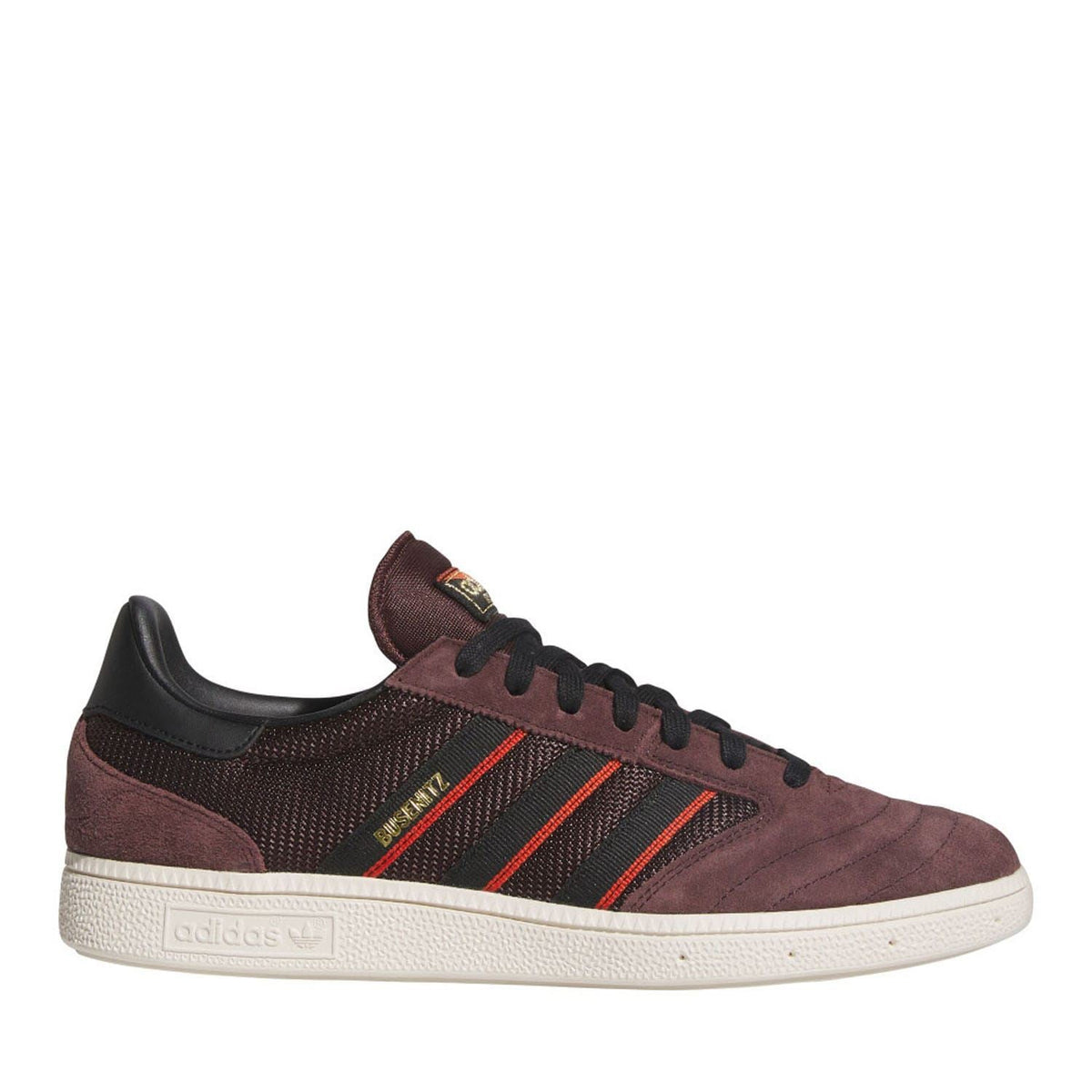 Brown and black low-top skate trainers with red stripes, black laces, and white rubber sole