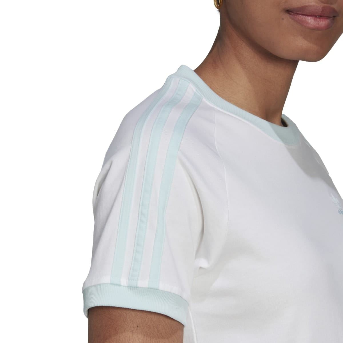 White T-shirt with small adidas logo on left chest and light blue collar trim