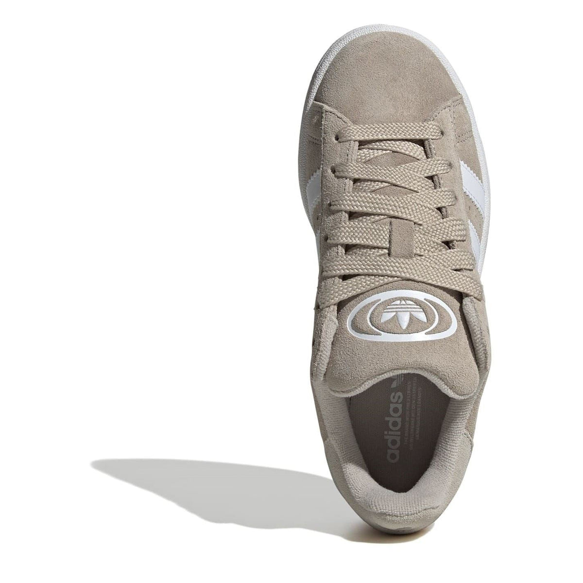 Beige low-top sneaker front view with lace-up design and adidas logo on tongue