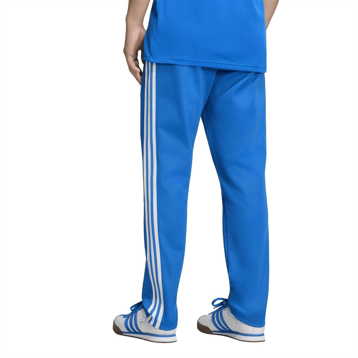 Blue athletic track pants with three white side stripes and small front emblem