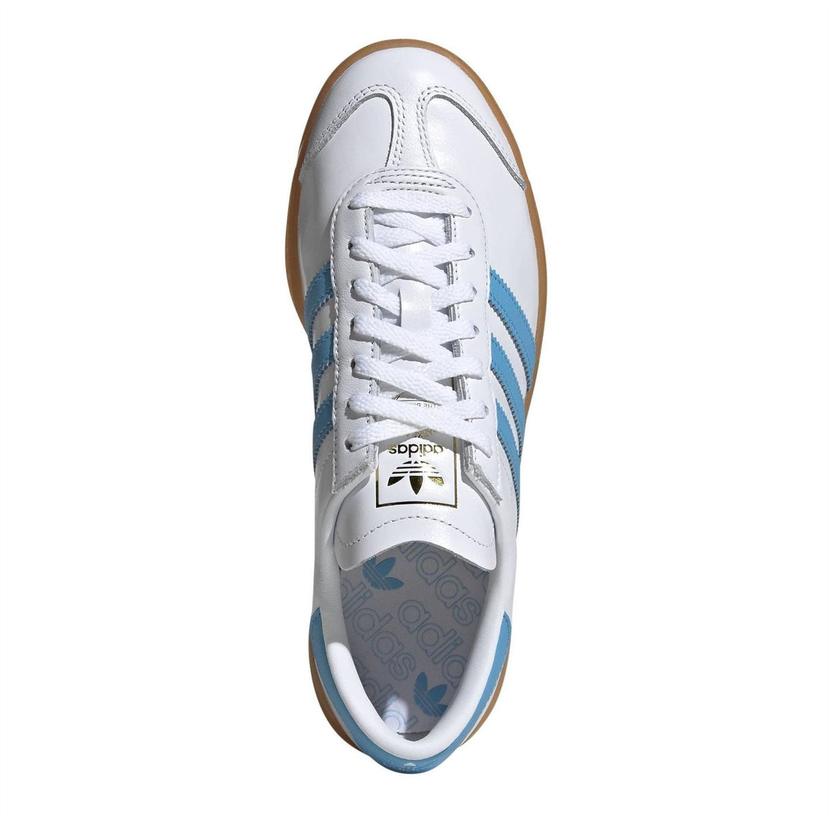 White leather trainers with light blue stripes and lace-up closure, top view