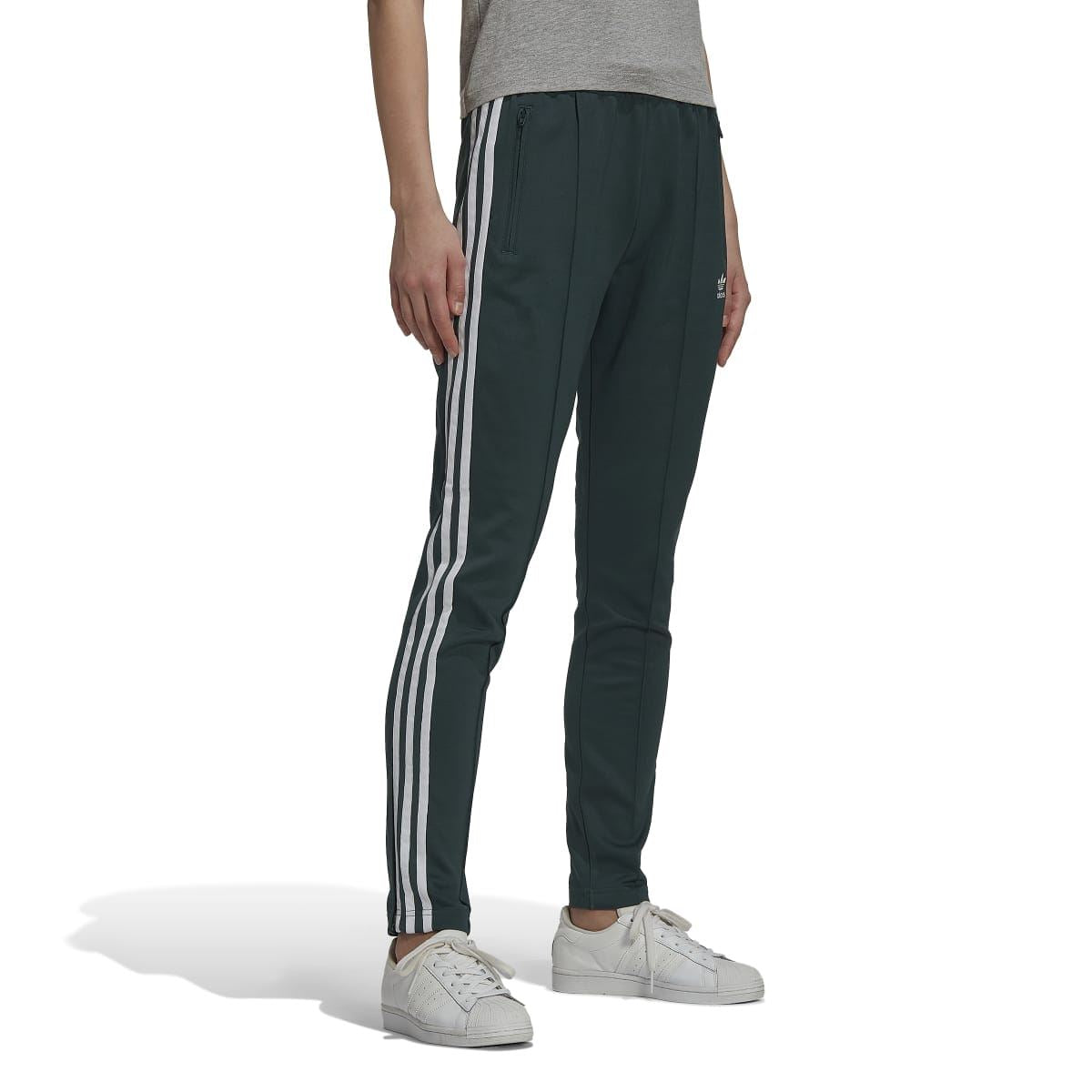 Dark green track pants from behind with white stripe panels and elastic waist