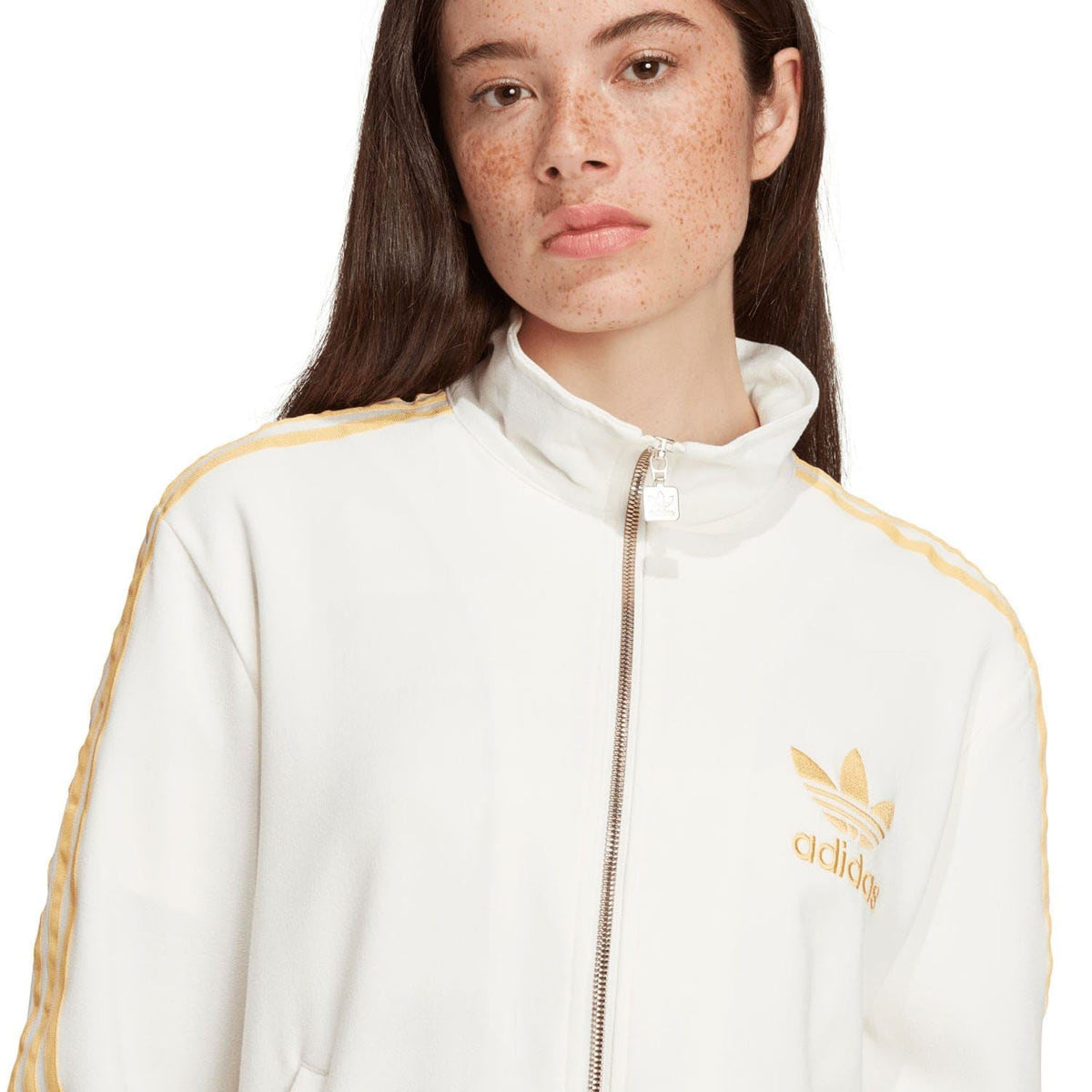 Off-white track top close-up with gold Adidas logo and zip stand collar