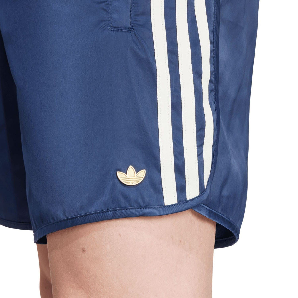 Indigo blue adidas Originals shorts with gold trefoil logo and white side stripes