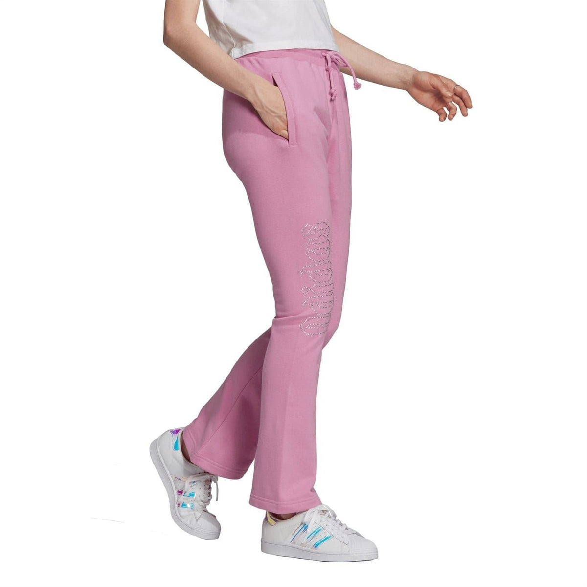 adidas Originals Luxe Track Pants featuring sleek design and comfortable fit, shown in black with subtle branding details.