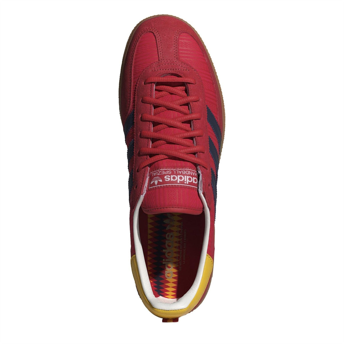 Red low-top lace-up trainers with white midsole and adidas logo on the tongue