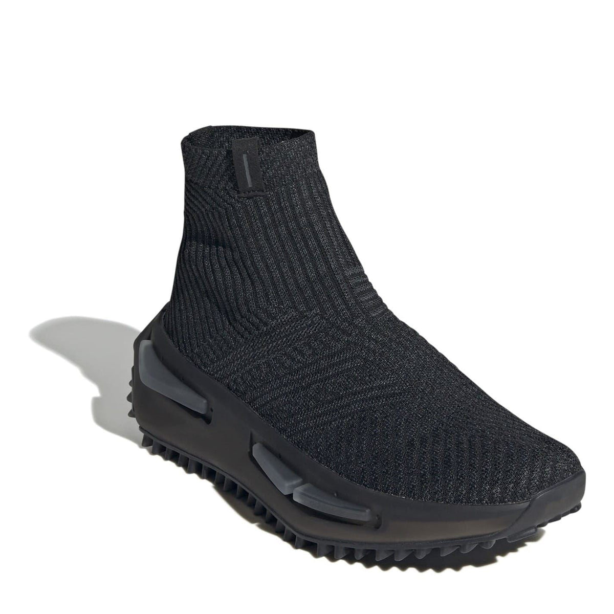 Black mid-ankle knit sneakers with molded TPU pods on the rubber sole