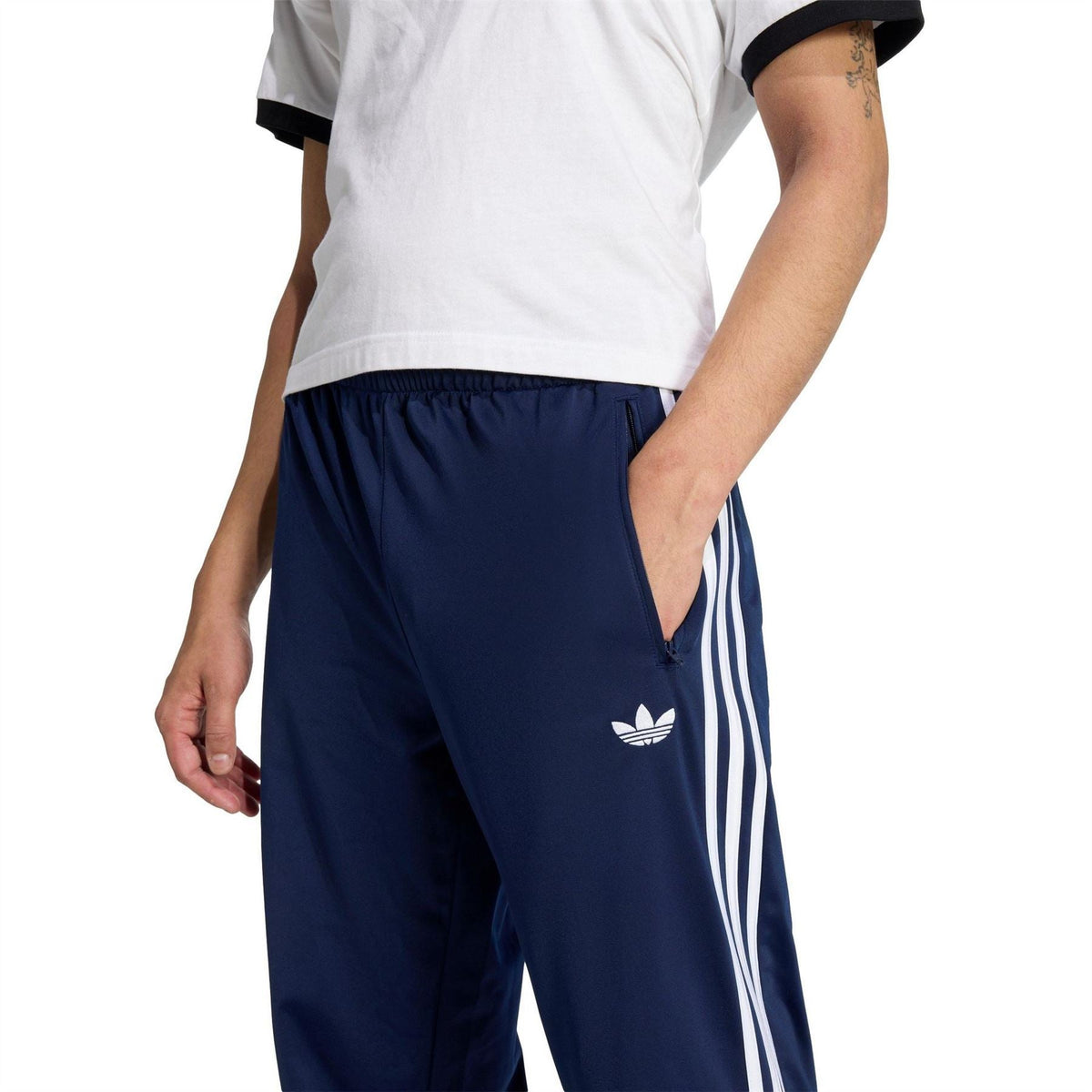 adidas men's navy track joggers with elastic waistband, trefoil logo, and white side stripes