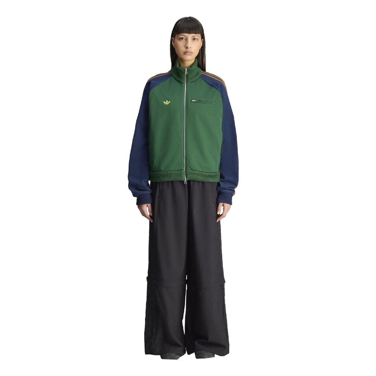 Green track top jacket with stand collar, full zipper, and small gold logo on chest