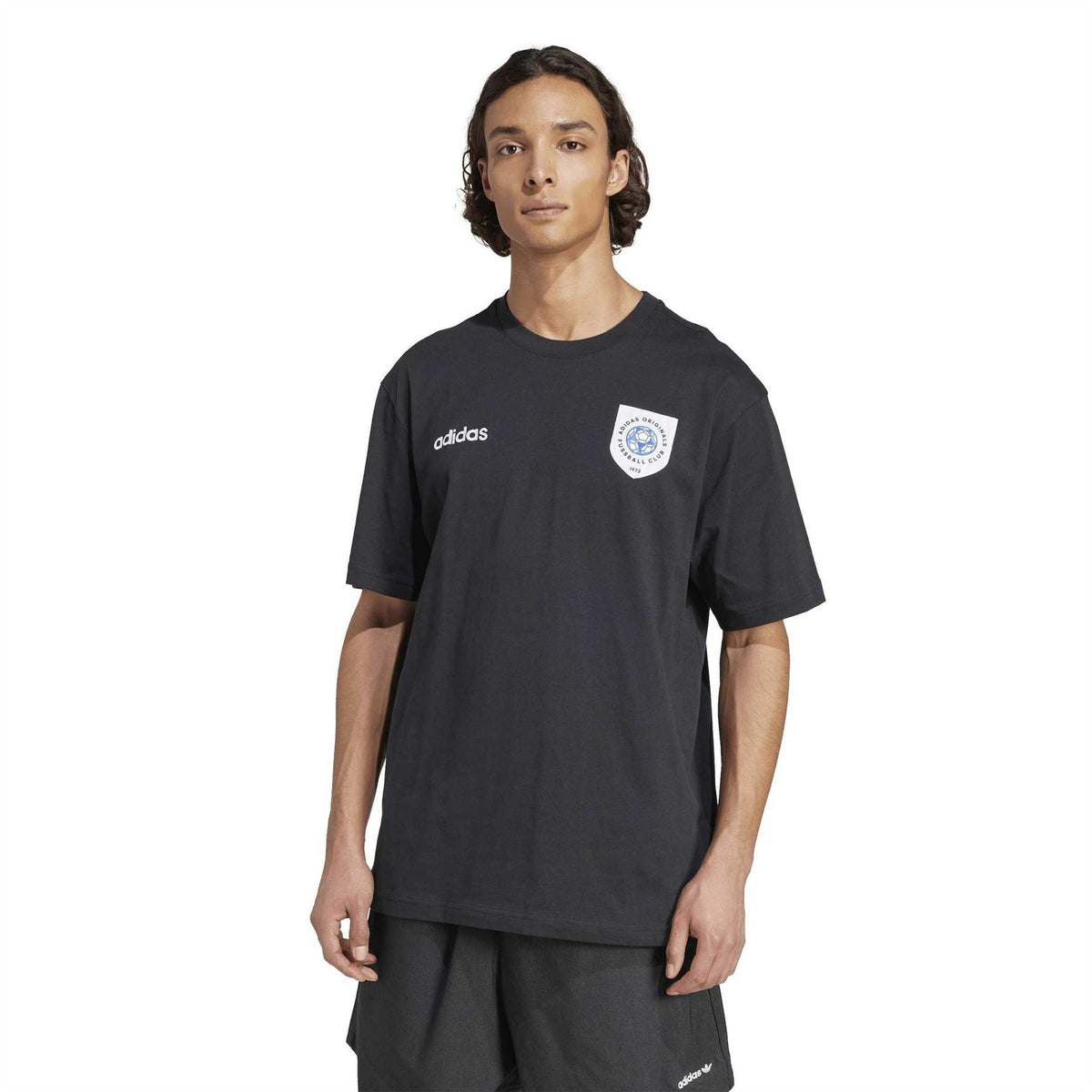 Black crew neck adidas T-shirt with small wordmark and round crest badge