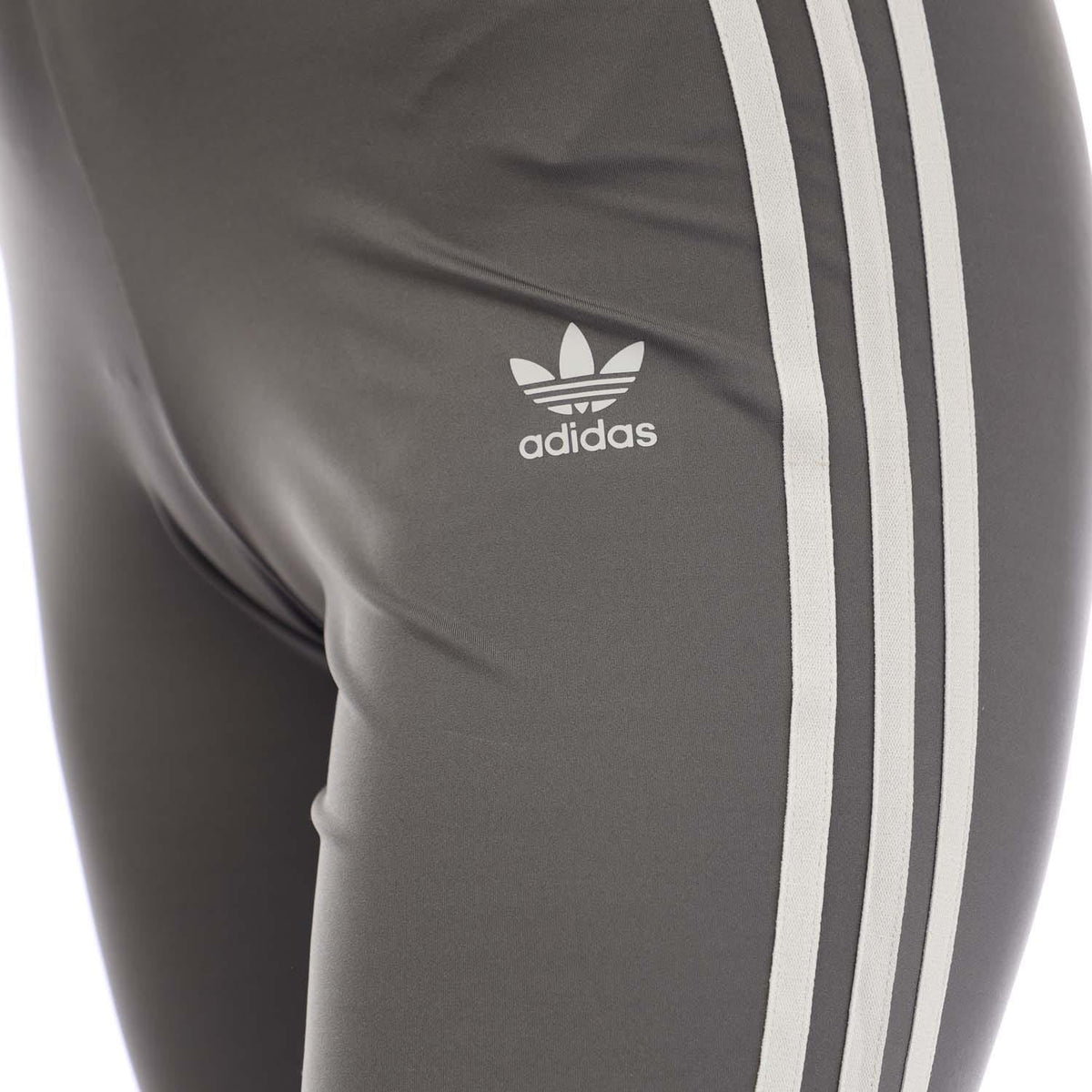 Grey leggings with white three-stripe detail and adidas trefoil logo