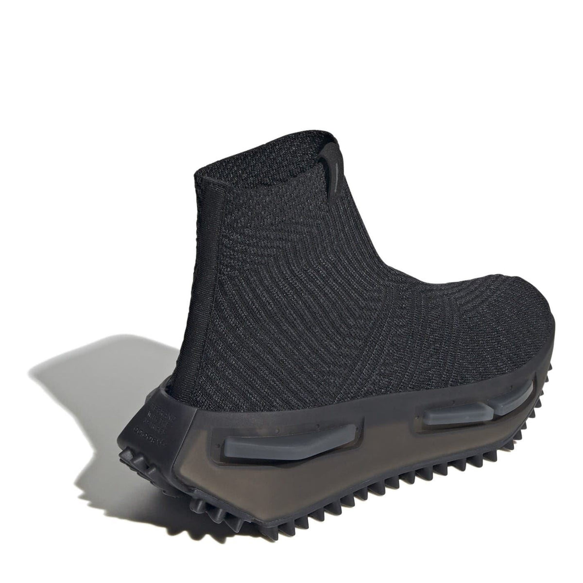 Black sock-style trainer with heel strap tab and treaded outsole pods