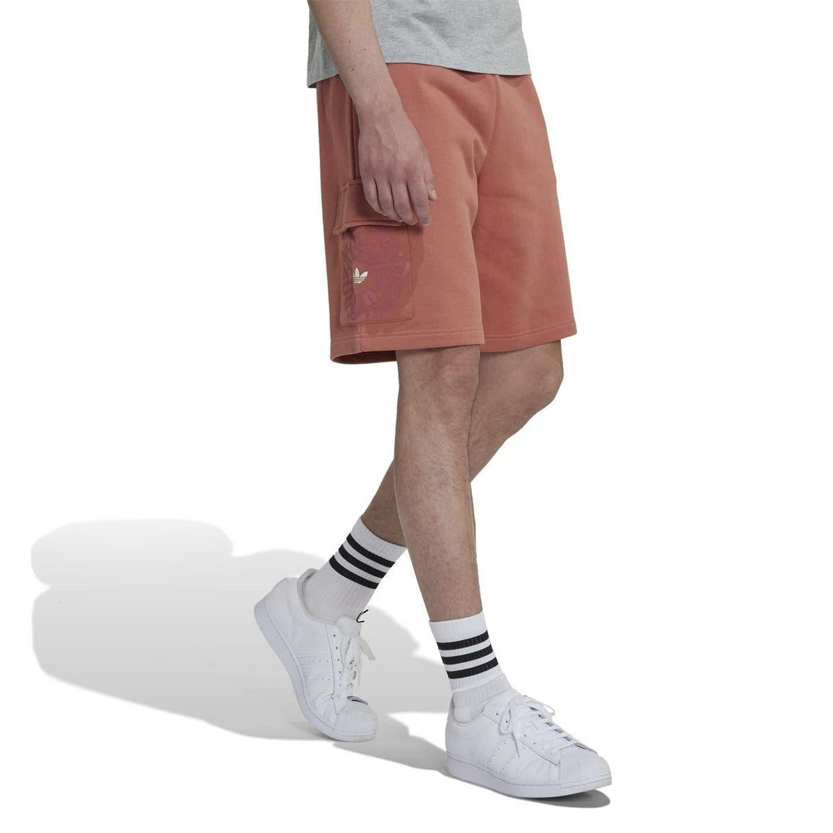 Brown cargo shorts with flap side pocket and knee-length hem