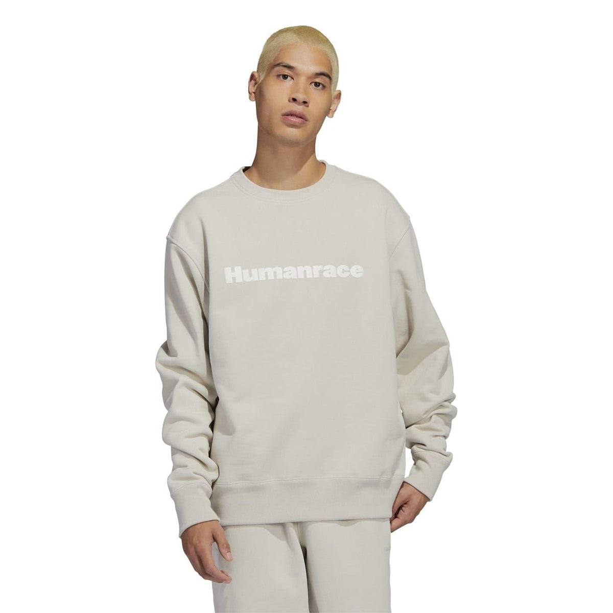 Light beige relaxed-fit crewneck sweatshirt with “Humanrace” logo on the chest.