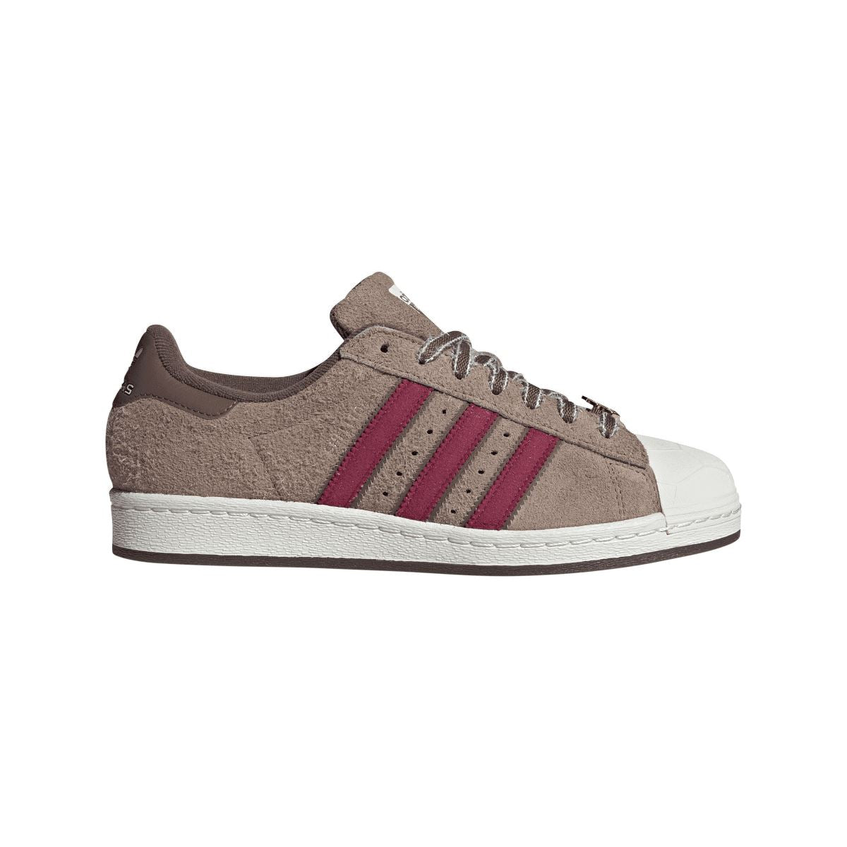 adidas Originals Teenage Mutant Ninja Turtles Superstar trainers featuring green and purple design with turtle-themed details for kids
