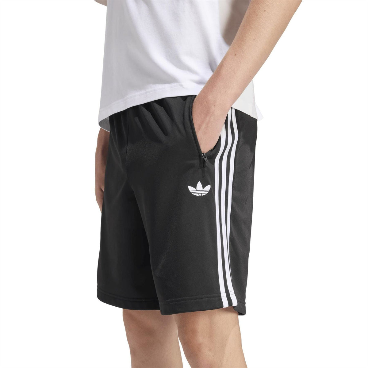 Black track shorts with white side stripes, front zip pocket, and adidas logo