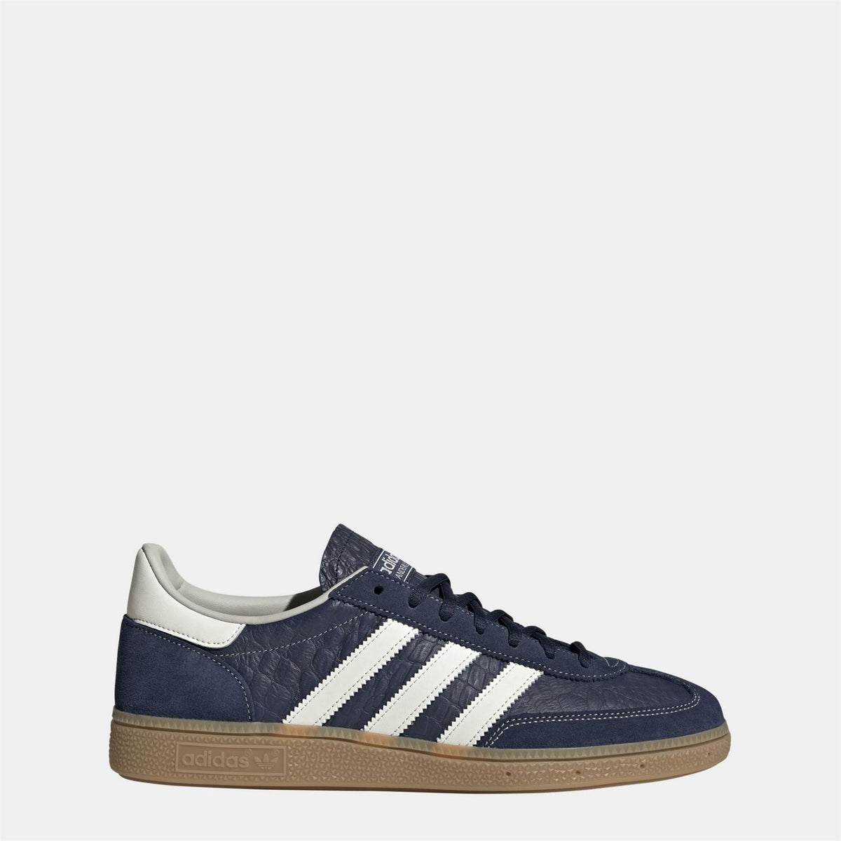 Navy suede low-top sneakers with lace-up front and gum rubber sole